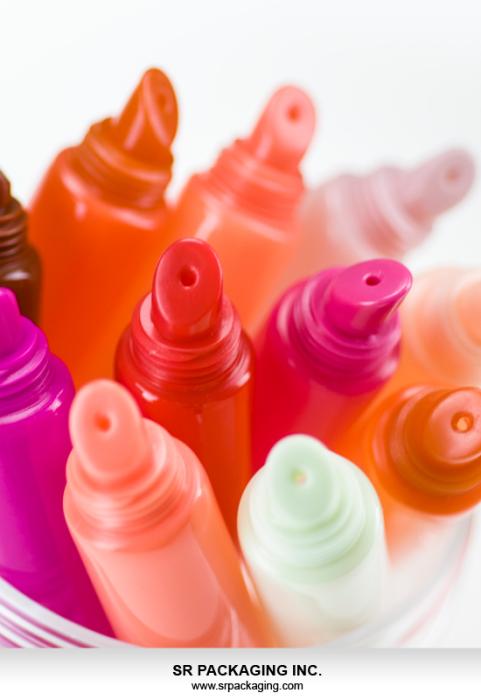 Colourful lipgloss tubes with oblique head for easy application